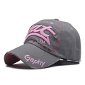 Close-up of distressed brim and 3D pink embroidery on a dark grey twill baseball cap - Adjustable / Grey with Pink Letters