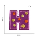 Detailed embroidery patch with purple base and yellow dots showing size 3.9cm measurement - Letter H