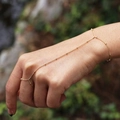 Elegant gold bead chain finger bracelet for women featuring a minimalist ring connection - Gold