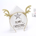 Detailed view of glittering Christmas reindeer antler headband with festive star patterns - Glitter Gold Antler Headband