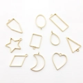 Set of 10 golden geometric hollow pendants for DIY jewelry making on white background - Mixed 10PCS KC Gold