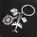 Macro detail of silver travel keychain with camera, compass, plane and passport charms - 4# (Airplane+Camera+Compass+Passport)