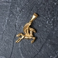 Macro shot of gold-plated pegasus pendant showing detailed wing texture on stone background - H02 3D Pegasus