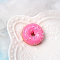 Pink resin donut charm with colorful sprinkles and star-shaped center for DIY crafts - Dotted Doughnut Rose Red