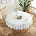 Close-up of white cotton round tablecloth featuring elegant ruffled edges and fabric texture - White Ruffle