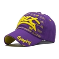 Close-up of vintage purple baseball cap with yellow 3D embroidery and distressed ripped brim - Adjustable / Purple with Yellow Letters