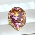 Luxurious gold teardrop ring featuring a pear-cut pink crystal and halo of clear stones - US 10 / Pink
