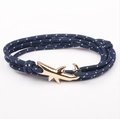 Detailed view of the dark blue nautical rope bracelet with a gold shark fin metal clasp - GSY-15 Blue White Dotted Rope + Gold Shark Hook