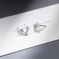 Asymmetric silver star and moon stud earrings featuring blue gems and clear zircons - Silver