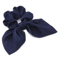 Detailed view of navy blue satin scrunchie with long ribbon bow on white background - Navy Blue