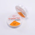 Macro shot of 0.7mm Crystal Tec clear elastic bead cord rolls for DIY jewelry making - 0.7mm