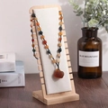 Bamboo stand showing amber and green bead necklace with large irregular pendant - Beige Velvet / Small Detachable / Beige
