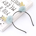 Close-up of gray-blue pom poms and golden glitter antlers on a Christmas reindeer headband - Blue Pompom Antler Headband