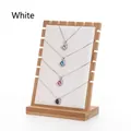 Detail of wooden display stand holding four necklaces with multi-colored gemstone pendants - White Leather / Large Detachable / White
