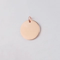 Macro shot of mirror-polished rose gold stainless steel round charm with jump ring - 8mm / Rose Gold (With Jump Ring)