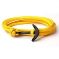 Detailed shot of yellow braided nylon rope bracelet with a glossy black anchor pendant - Yellow