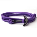 Close-up of purple braided nylon cord bracelet featuring a black metal anchor clasp - Purple