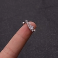 Close-up of star-shaped zircon ear stud with stainless steel screw ball back on finger - Star Style (8#)