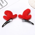 Detailed view of red plush reindeer antler hair clips with metal alligator grip - Cloth Reindeer Antler - Red Pair