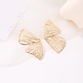 Hollow gold butterfly stud earrings featuring intricate wing textures on a white background - Gold