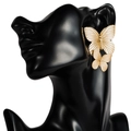 Golden double butterfly earrings on black model head portrait with a minimalist metallic style - Gold Butterfly