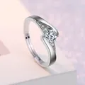 Macro shot of silver adjustable ring with a brilliant-cut center stone and paved accents - Adjustable / Style 12 Cross Band Ring (0.5 Carat)