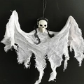 Close-up of Halloween hanging ghost with skull and white mesh fabric on dark background - White