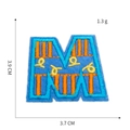 Close-up of letter M embroidery patch showing blue base with orange and yellow stitching - M