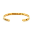 Macro detail of gold plated cuff bracelet showing the YOU FUCKING GOT THIS engraving - Engraved-Gold