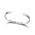 Macro detail of the 'ENCOUNTER' engraving on a silver titanium steel cuff bracelet. - Engraved Style / Silver