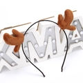 Brown plush reindeer antler headband on XMAS prop with festive lights on white background - Fabric Brown Antler Headband