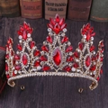 Detailed macro view of vintage gold crown with red crystals on classical books - KC Gold Red Rhinestone