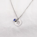 Detailed close-up of Virgo zodiac necklace with a blue birthstone on white fabric - Virgo Blue Rhinestone (Shades 6-9)