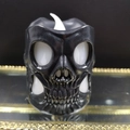 Skull LED flameless candle with detailed carving and a white flame light effect - Skull Light-Black White Eyes
