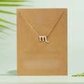 Gold Scorpio constellation symbol necklace with rhinestone on a kraft paper gift card - Scorpio / Gold