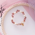 Detailed close-up of handmade beaded bracelet with pink stones and shell charms - Dark Pink