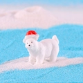 Miniature white polar bear figurine wearing a red Christmas hat on a snowy scene - Small Polar Bear with Red Hat