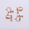 Close-up of four KC Gold plated screw-back ear clip converters for DIY jewelry making - 15x13mm / 10 Pieces Pack / KC Gold