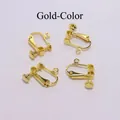 Vista macro de 4 clips de pendientes de rosca dorados para creación de joyería DIY - Dorado