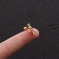 Macro detail of gold-plated stud earring featuring baguette-cut zircon and screw back - 2# (White Rectangular) / Gold