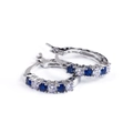 Silver hoop earrings with alternating blue sapphires and white zircons in a huggie style - Blue