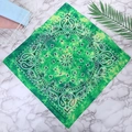 Green paisley cotton bandana featuring vintage tie-dye pattern and paisley print design - One Size / Grass Green