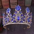 Detailed view of a golden crown with navy blue teardrop gems and floral crystal accents - KC Gold Royal Blue Rhinestone