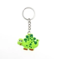 Close-up of a green cartoon dinosaur keychain with soft PVC texture and metal keyring - Green Cartoon Dinosaur