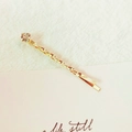 Elegant gold twisted metal hair pin featuring a single sparkling round rhinestone accent - Single Zirconia Twist (3540)