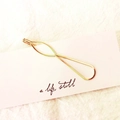 Elegant gold metal hair clip with minimalist geometric curves on display card - Gourd Shape (3539)