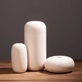 Three-piece modern white ceramic vase set with elegant spiral texture on wooden table - White (Set of 3)