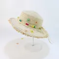 Kids beige straw sun hat with wave fringe edges and colorful floral bead strap - Beige - Daisy Bead Frayed Edge
