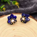Lapis lazuli petal earrings with freshwater pearl centers on wooden display stand - Lapis Lazuli
