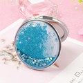 Portable round compact mirror featuring blue flowing quicksand and heart-shaped sequins - Round / Blue Quicksand